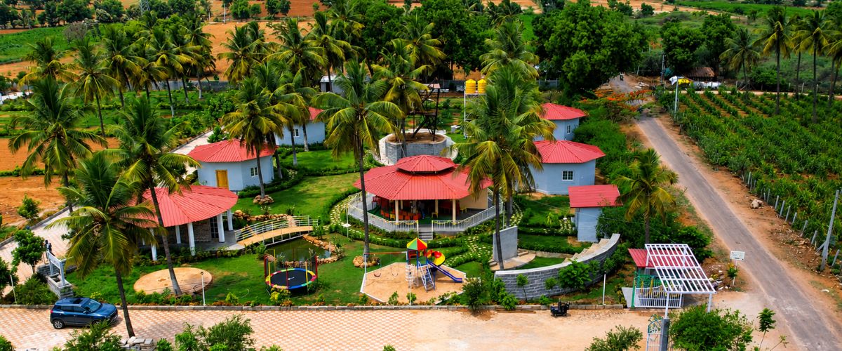 Aerial view of nandi farm resort with red-roof villas